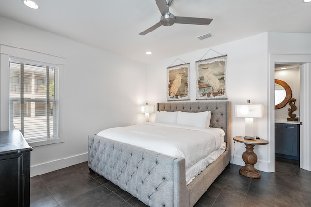 bedroom featuring ceiling fan and dark tile floors