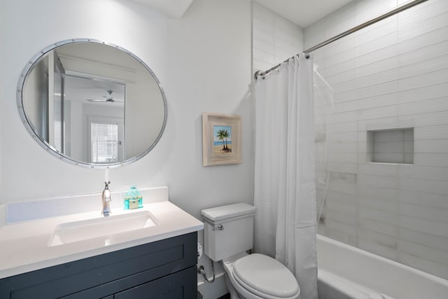 full bathroom with ceiling fan, vanity, toilet, and shower / tub combo