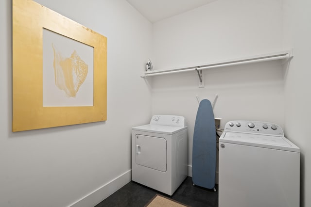 laundry room with washer hookup and washing machine and clothes dryer