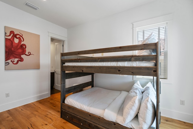 bedroom with light wood-type flooring