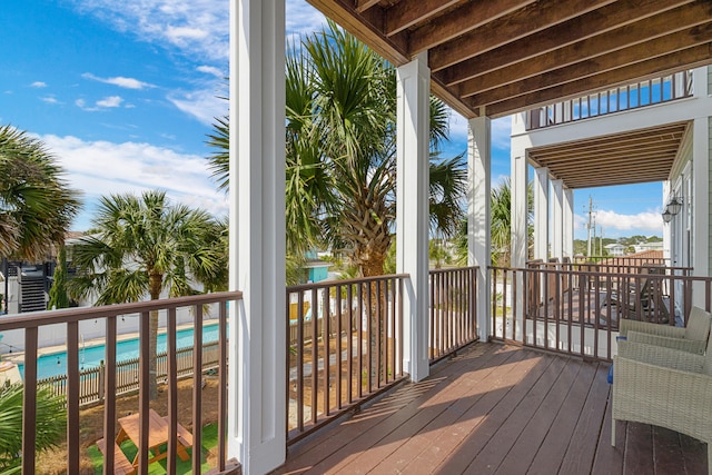 deck with a fenced in pool