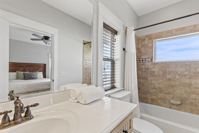 full bathroom featuring plenty of natural light, ceiling fan, shower / bath combo with shower curtain, and toilet