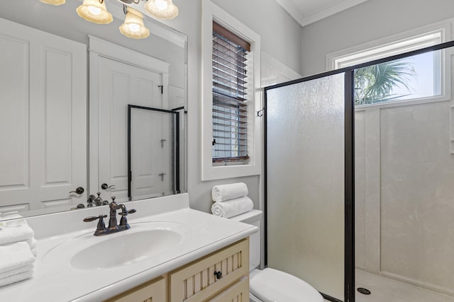 bathroom with a shower with door, crown molding, toilet, and vanity