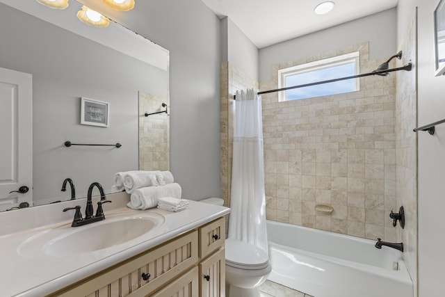 full bathroom featuring oversized vanity, toilet, tile floors, and shower / bath combo