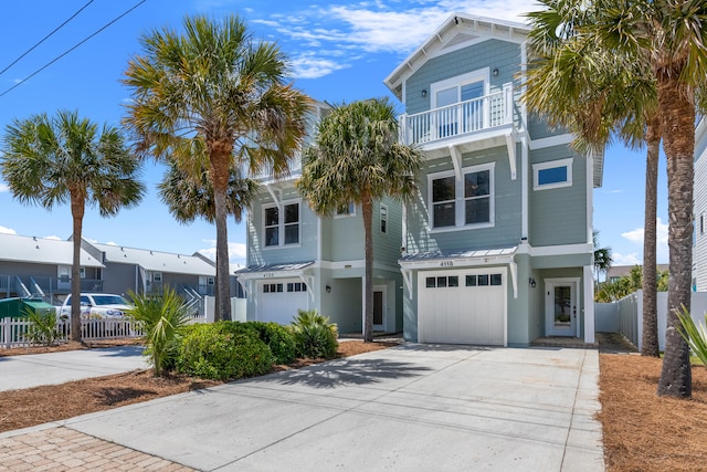 beach home with a garage and a balcony