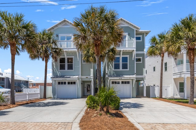 beach home with a garage and a balcony