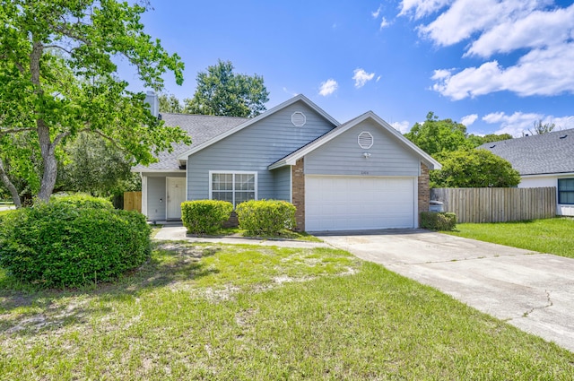 single story home featuring a garage and a front yard