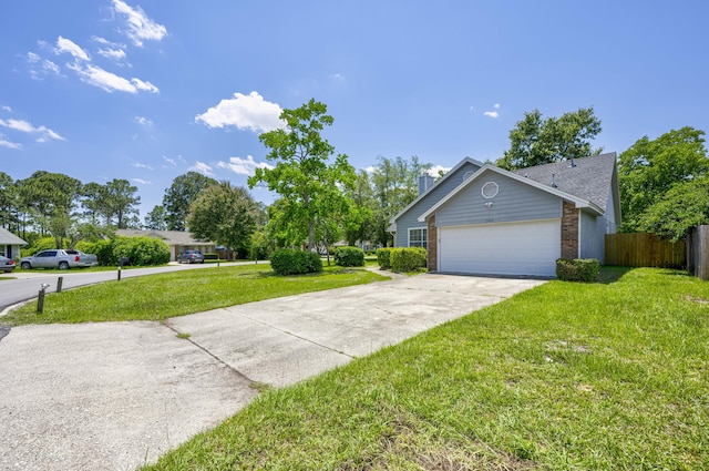 view of front of property featuring a garage and a front lawn