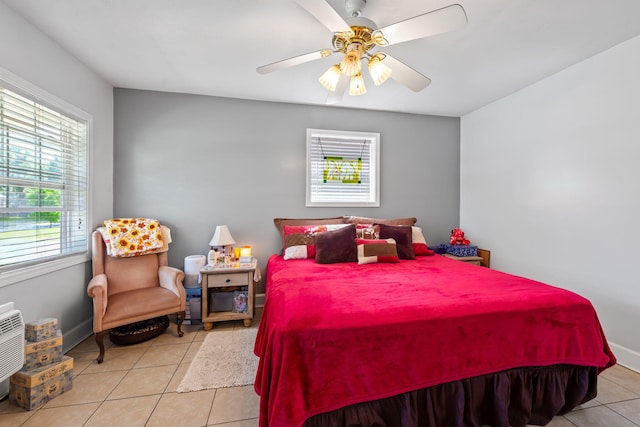 bedroom featuring ceiling fan and tile floors