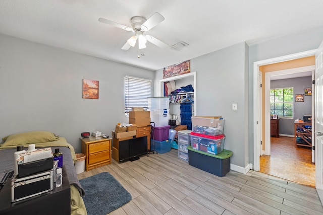 office area with ceiling fan and light parquet flooring