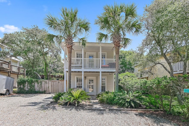 view of front of home with covered porch and a balcony