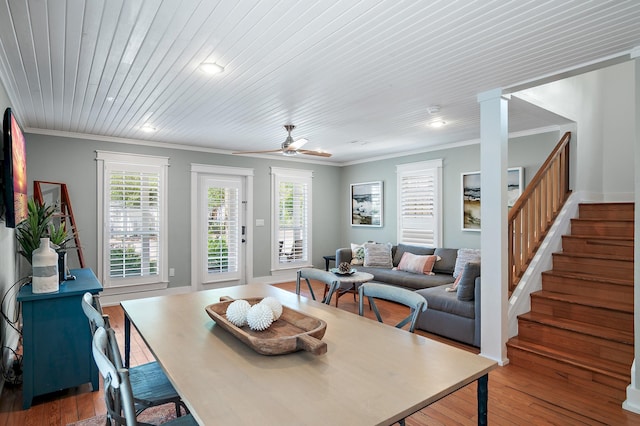 dining room with hardwood / wood-style flooring, ceiling fan, and ornamental molding