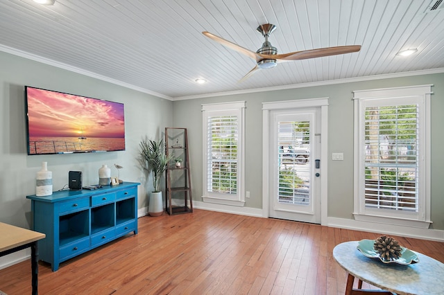 doorway featuring light hardwood / wood-style flooring, ceiling fan, crown molding, and wood ceiling