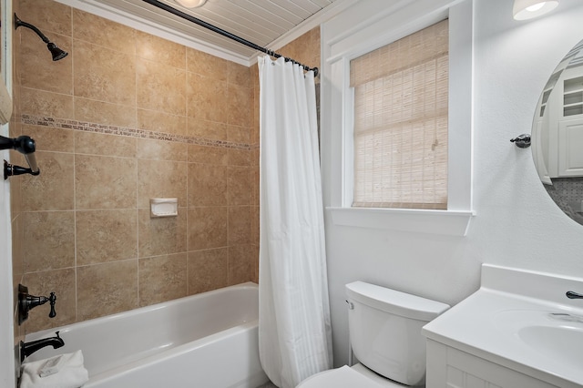 full bathroom featuring vanity, toilet, shower / bath combo with shower curtain, and crown molding