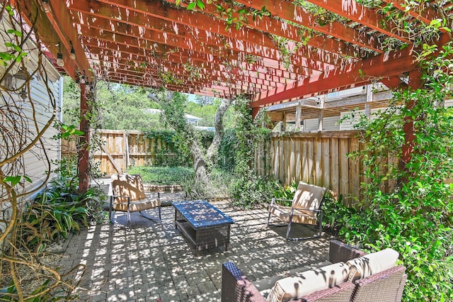 view of patio / terrace with an outdoor living space and a pergola