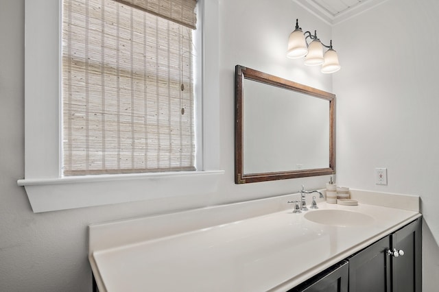 bathroom with vanity and ornamental molding