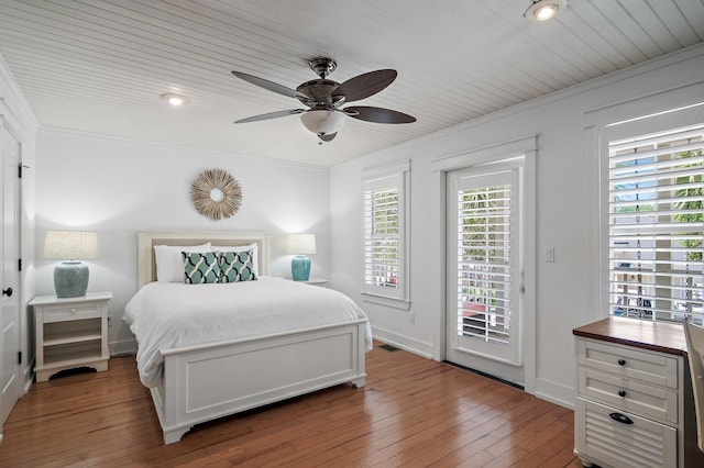 bedroom featuring access to outside, ceiling fan, hardwood / wood-style floors, and crown molding