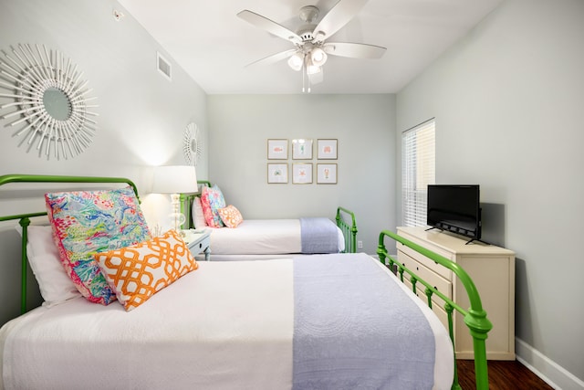 bedroom featuring ceiling fan and hardwood / wood-style flooring