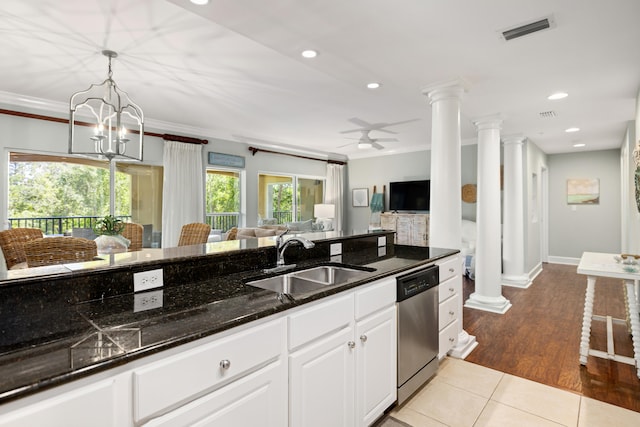 kitchen with light hardwood / wood-style floors, dishwasher, ceiling fan with notable chandelier, sink, and white cabinets