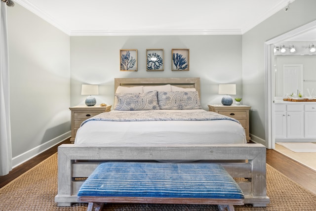 bedroom with ensuite bathroom, hardwood / wood-style flooring, and crown molding