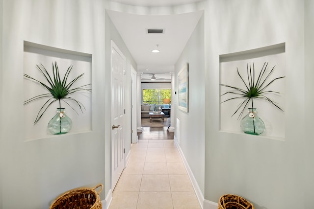 hallway with light tile floors