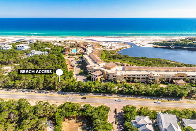 bird's eye view featuring a view of the beach and a water view