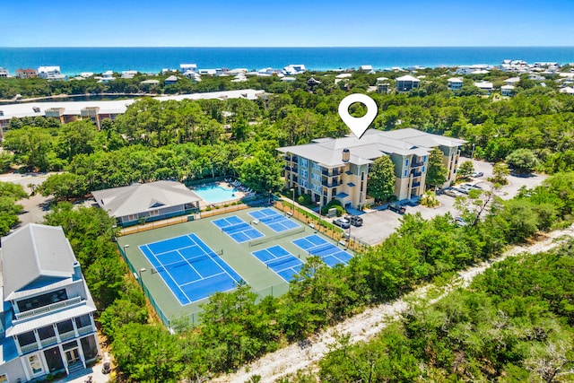 birds eye view of property with a water view