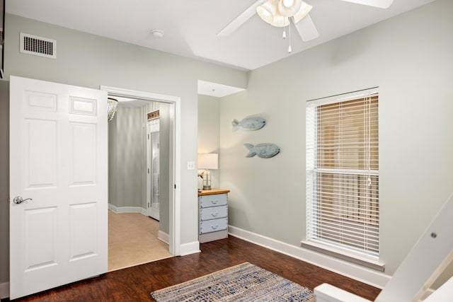 tiled bedroom with ceiling fan