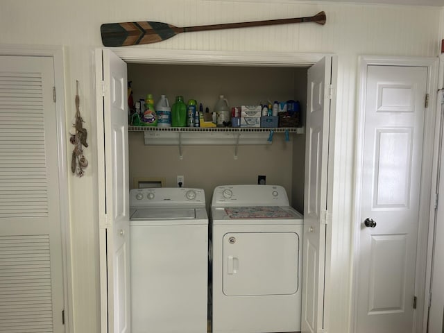 laundry area with separate washer and dryer