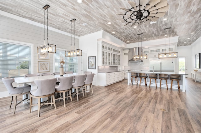 dining area featuring light hardwood / wood-style floors and a healthy amount of sunlight