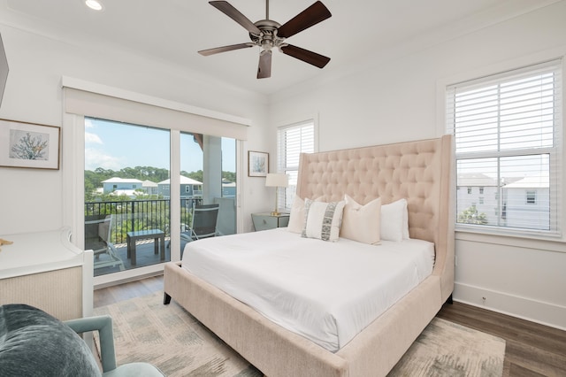 bedroom with multiple windows, hardwood / wood-style floors, and ceiling fan