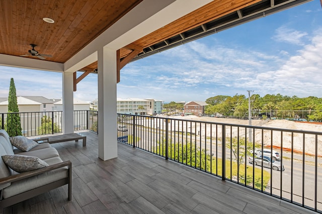 wooden terrace featuring ceiling fan