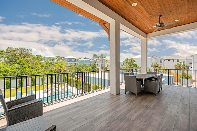 wooden deck featuring ceiling fan