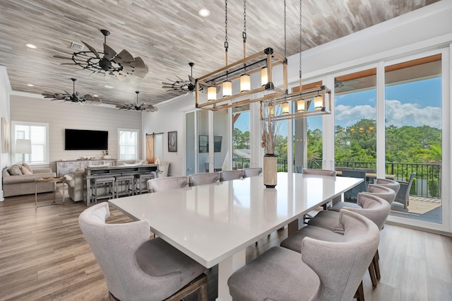 dining space with light hardwood / wood-style flooring