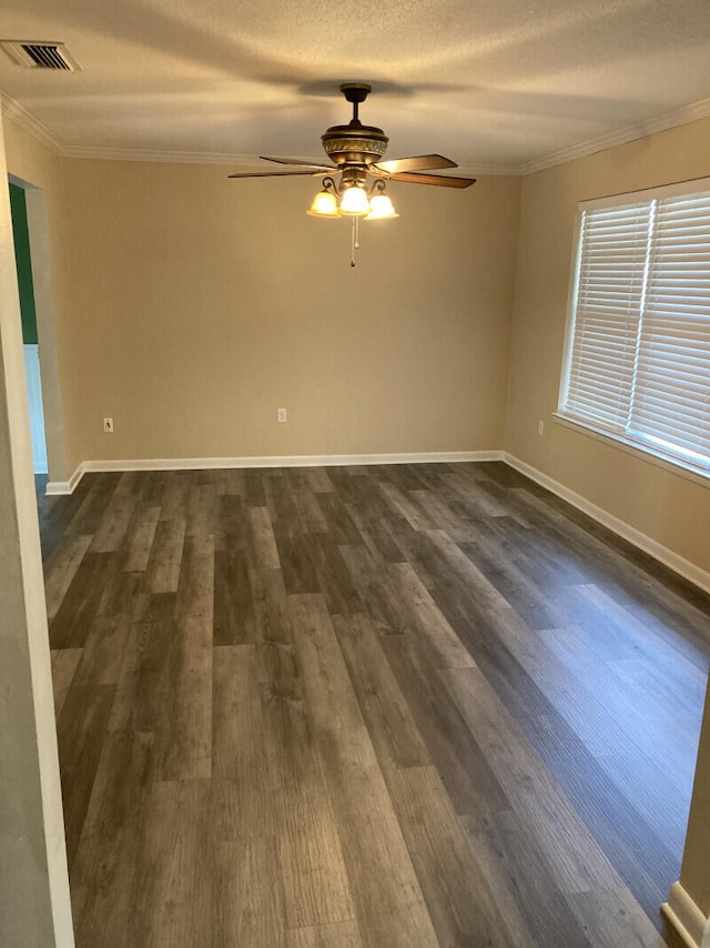 spare room with crown molding, ceiling fan, dark hardwood / wood-style flooring, and a textured ceiling