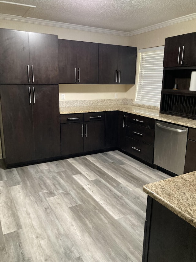 kitchen with dishwasher, light hardwood / wood-style floors, and a textured ceiling