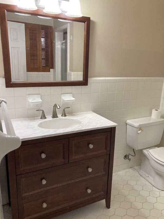 bathroom with backsplash, tile flooring, tile walls, and toilet