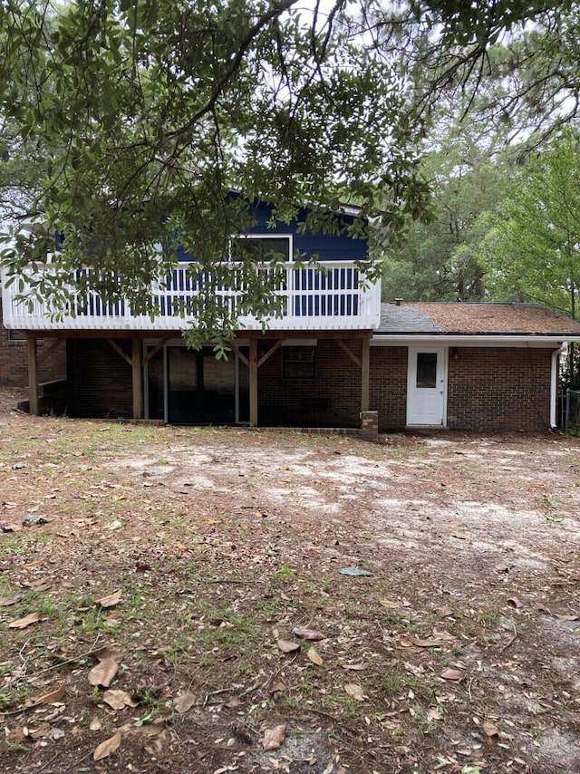 rear view of property with a deck