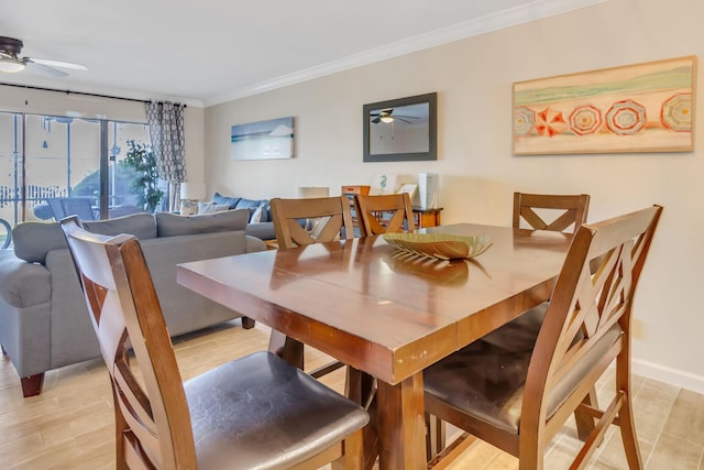 dining area featuring light hardwood / wood-style flooring, ceiling fan, and crown molding