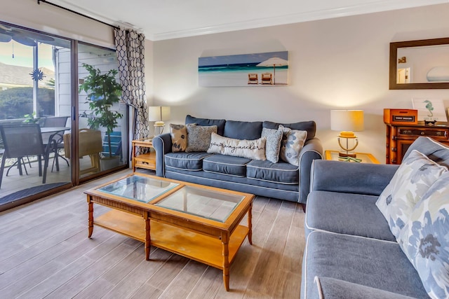 living room featuring hardwood / wood-style floors and ornamental molding