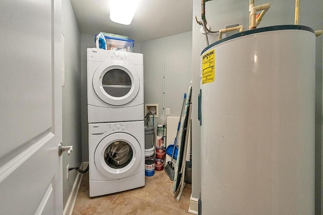 laundry area featuring stacked washing maching and dryer and water heater