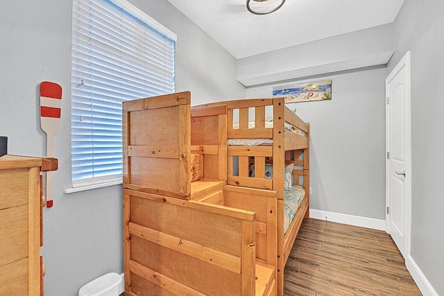 bedroom with wood-type flooring