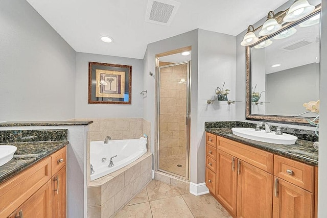 bathroom featuring tile patterned floors, vanity, and independent shower and bath