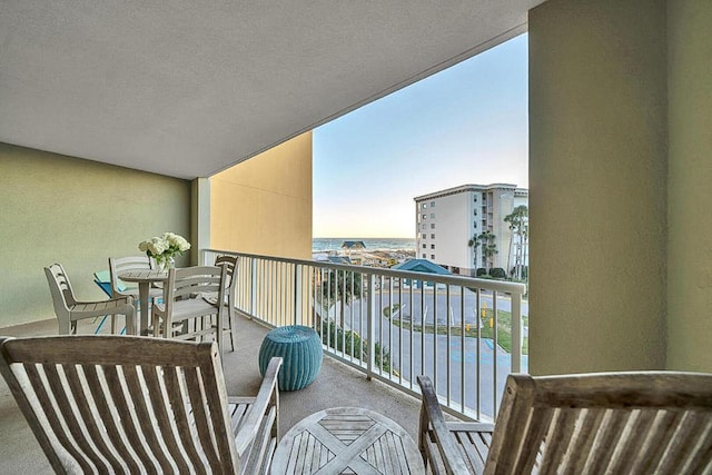 balcony featuring a water view