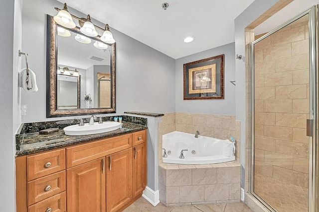 bathroom featuring tile patterned floors, shower with separate bathtub, and vanity