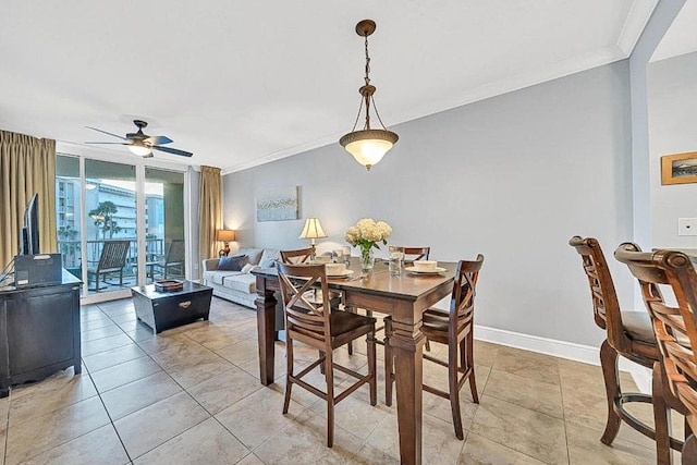 tiled dining area featuring crown molding, floor to ceiling windows, and ceiling fan