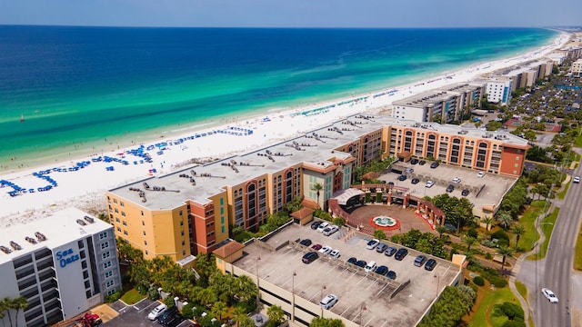 birds eye view of property with a view of the beach and a water view