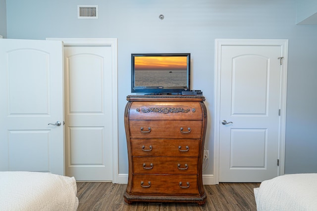 bedroom featuring dark wood-type flooring