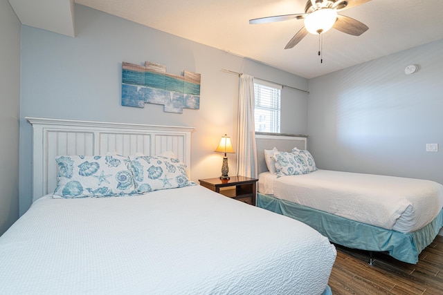 bedroom featuring ceiling fan and dark hardwood / wood-style flooring