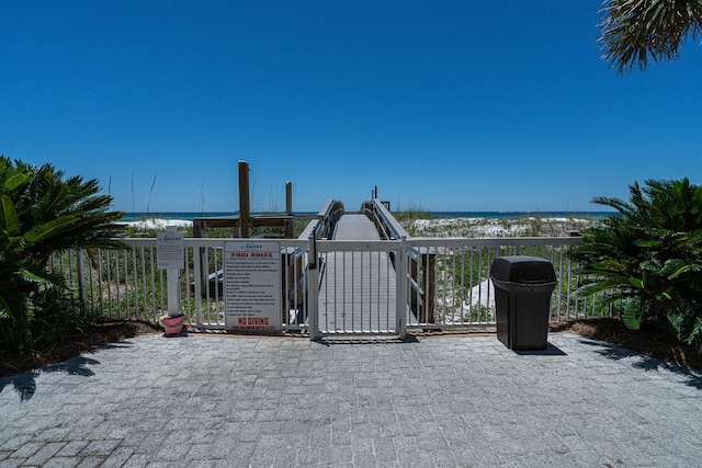 view of gate with a water view